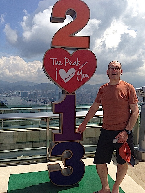 image of me standing next to a sign that makes the year 2013 with numbers stacked on top o each other. The zero is a heart which says The Peak, I Love you