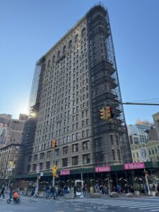 The flat iron building covered in scaffolding