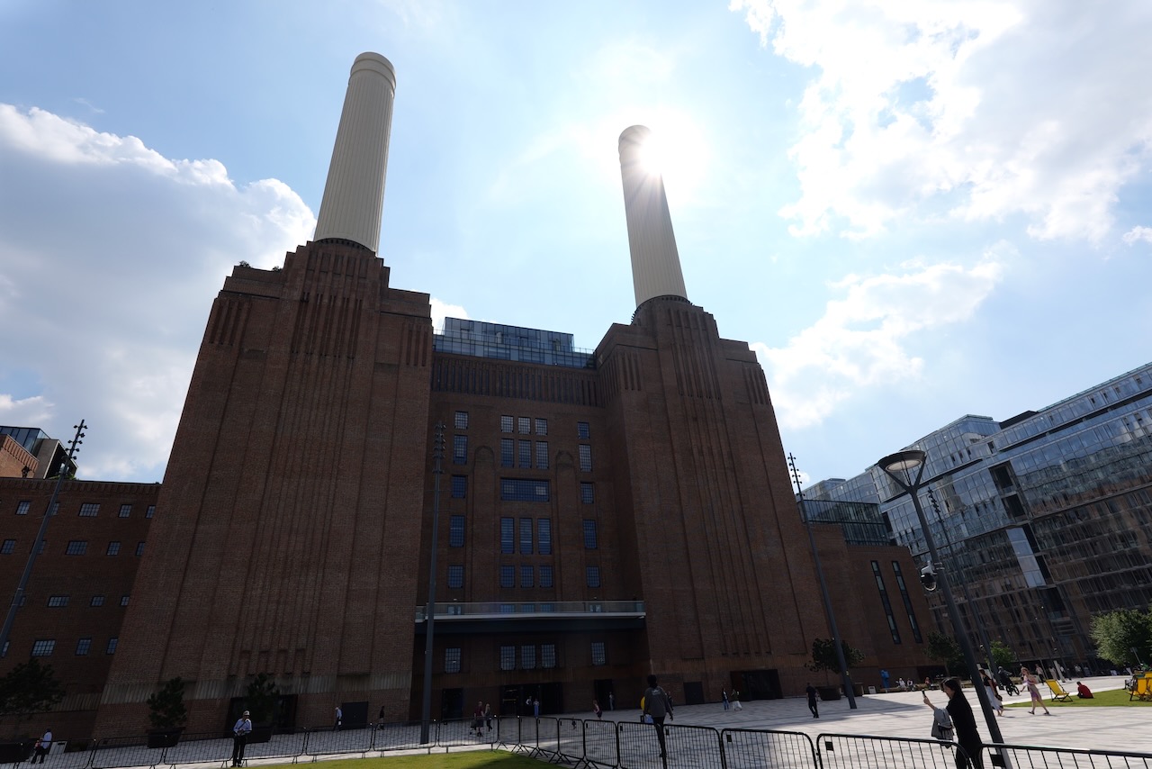 From the front, the sun flaring behind a chimney