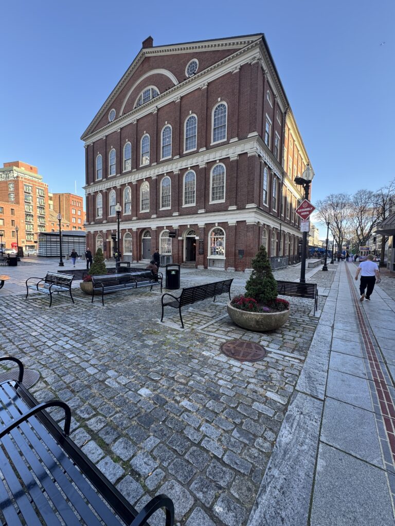 Faneuil hall a 4 story large brick building.