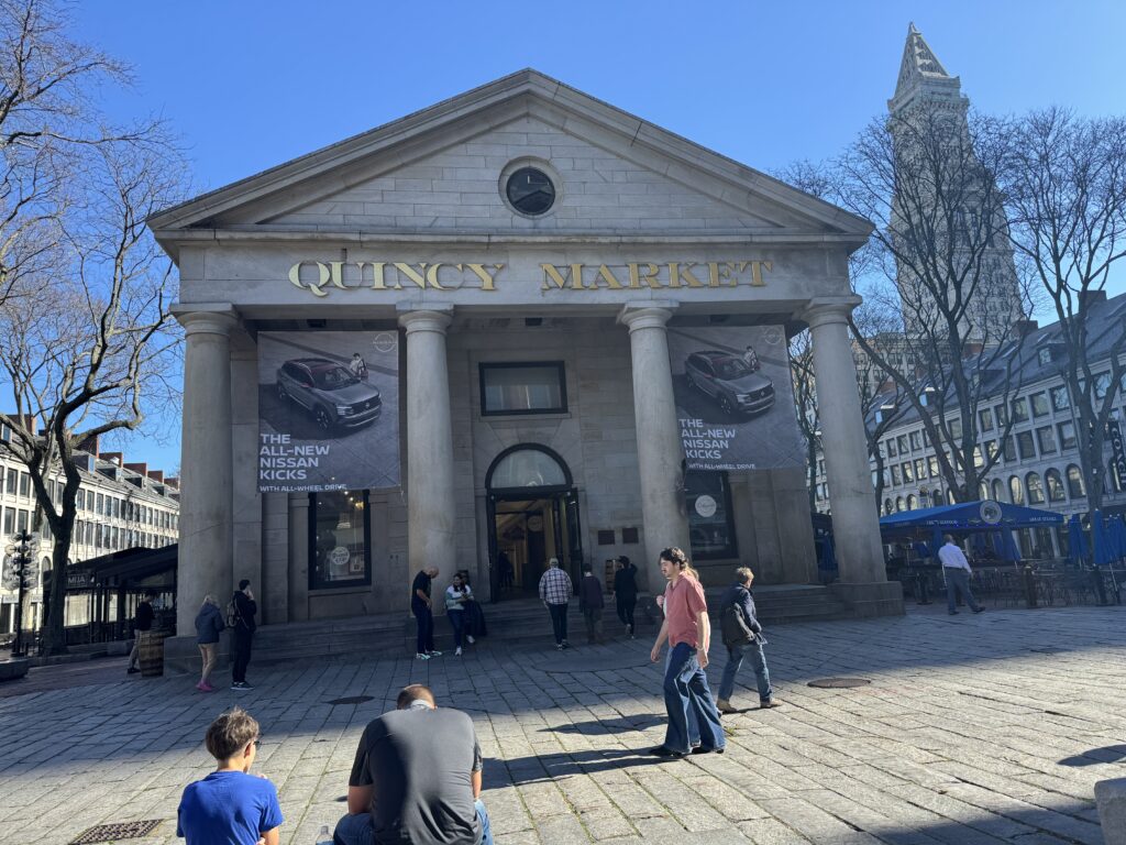 Quincy market building. Four columns stand at the front.