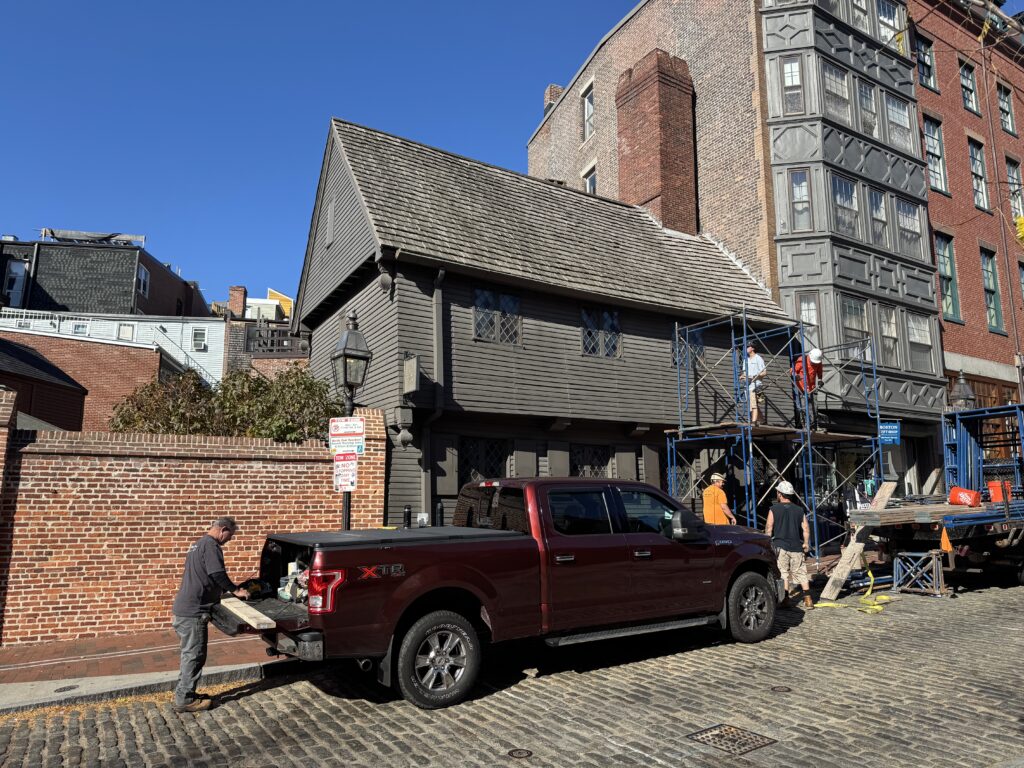Paul revere house. A grey weathered wooden 2 story building with a frame roof.