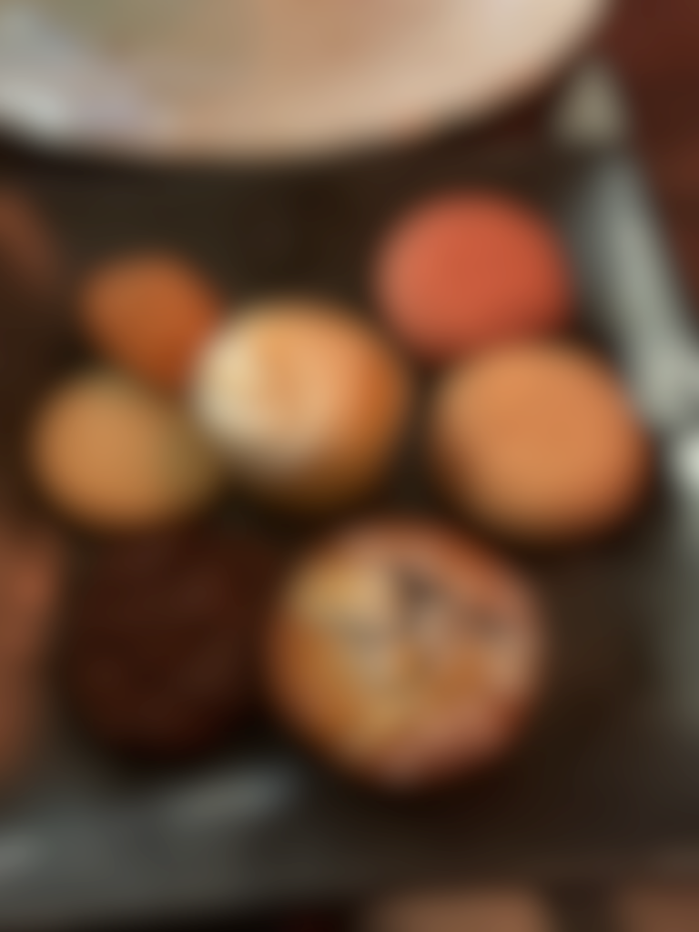 Blurred image of cakes on a plate.